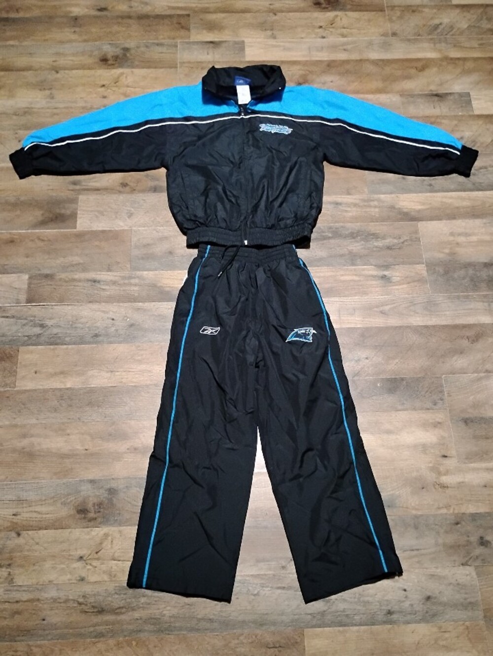 Reebok Carolina Panthers Black and Teal Blue  Track Suit Boy's Size: S(8)